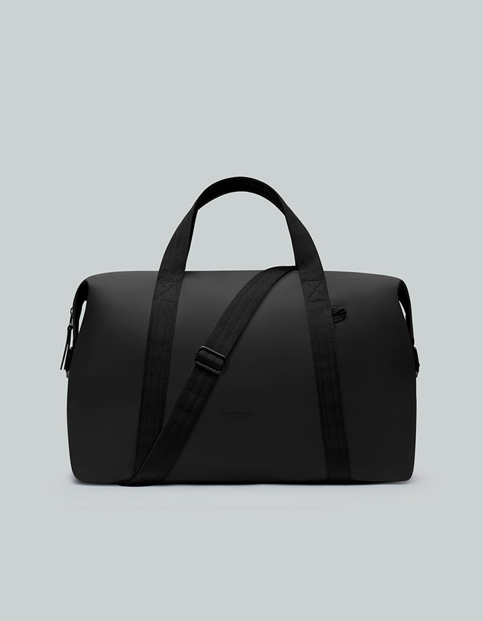 Bolso de viaje Däsh CH Negro, vista frontal con asas y correa