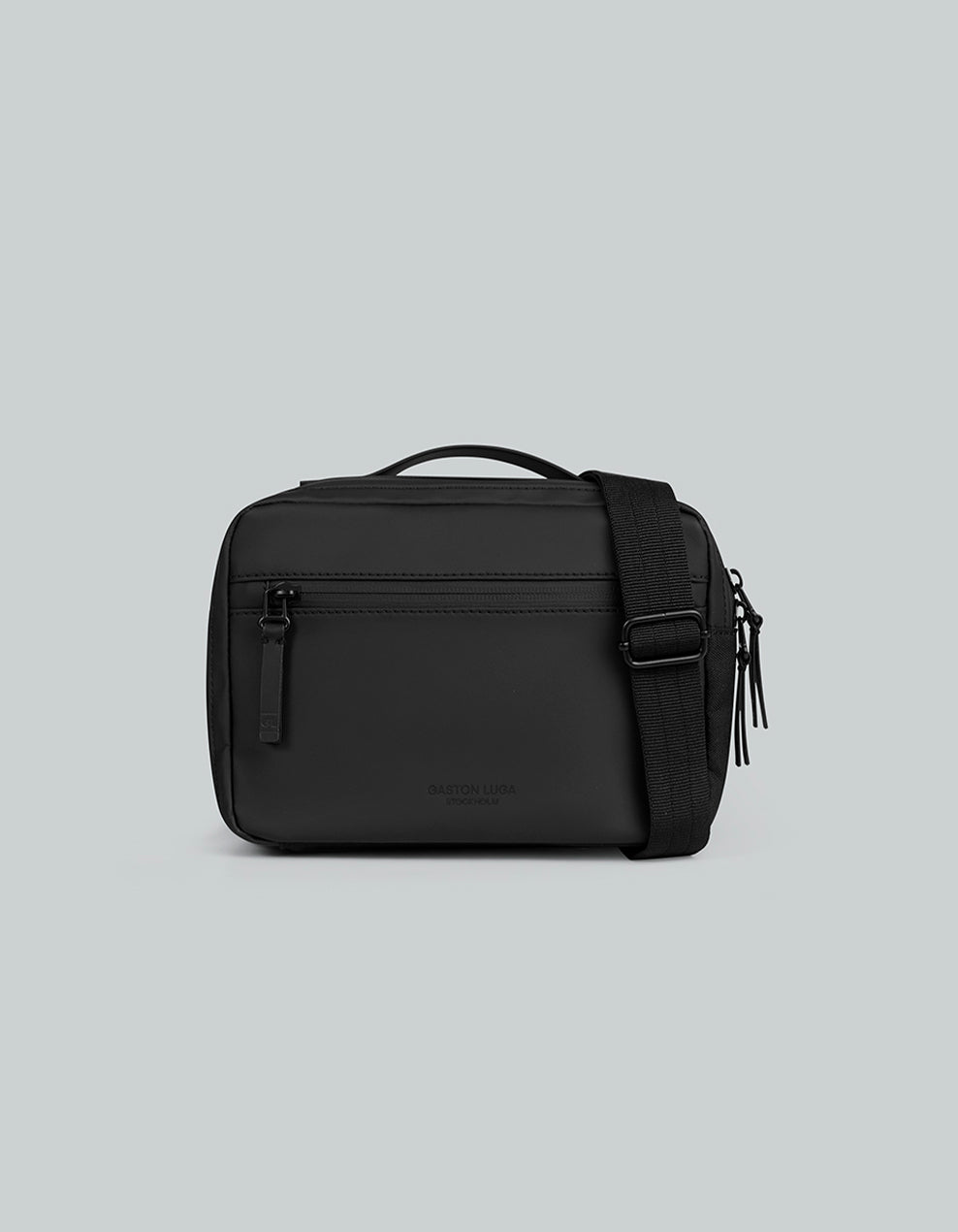 Bolso Däsh Box Bag Negro, vista frontal con correa