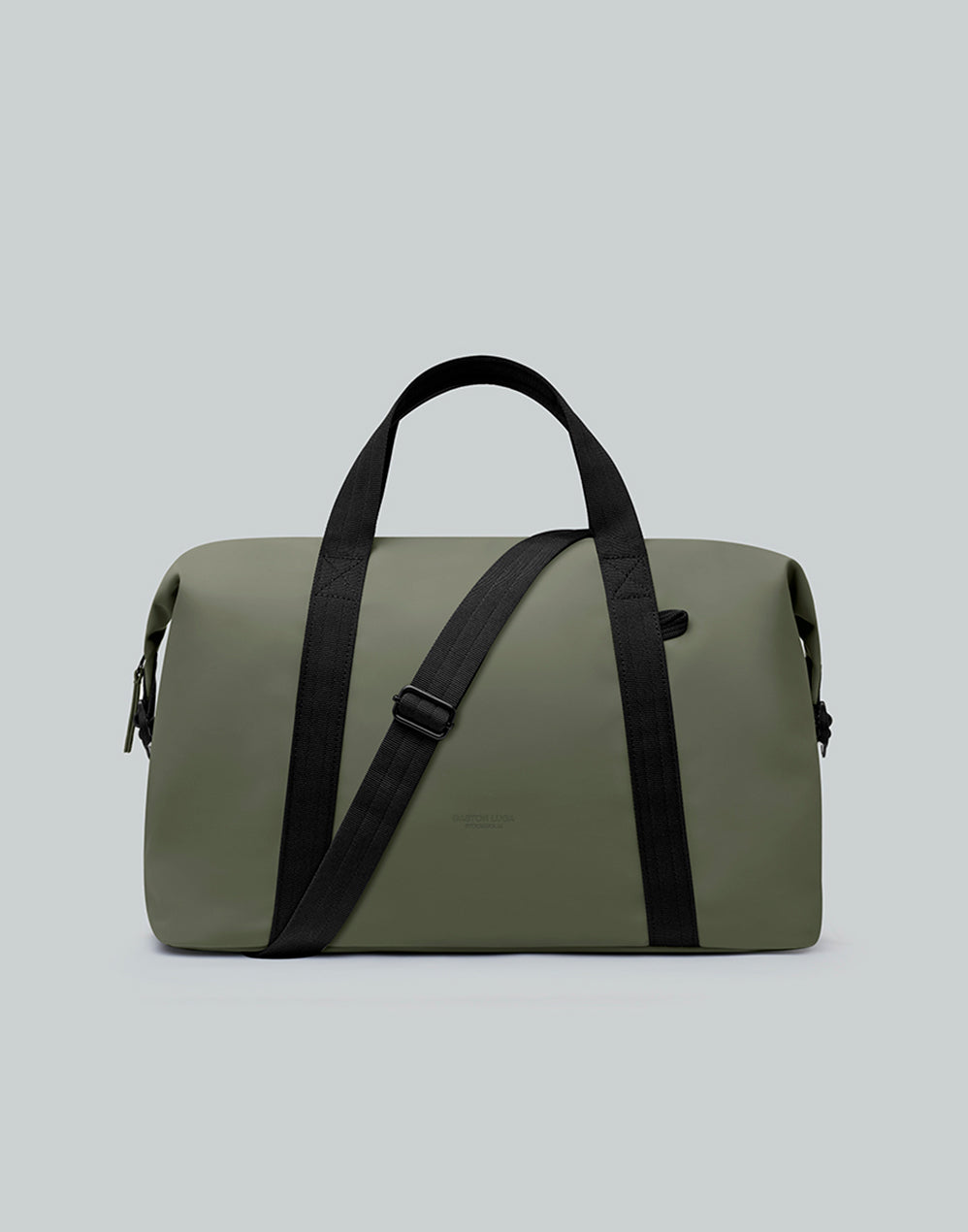 Bolso de viaje Däsh CH Olivo, vista frontal con asas y correa