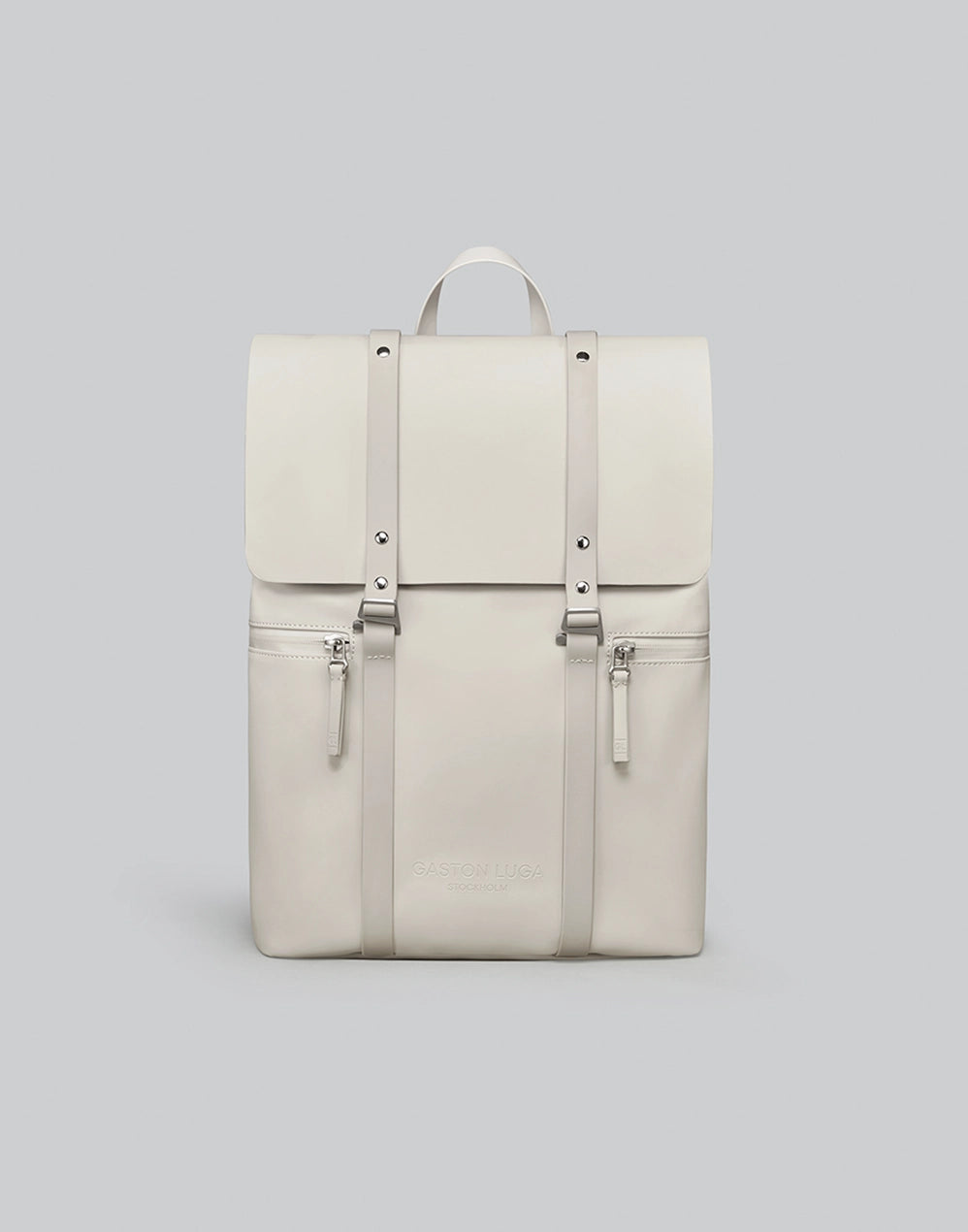 Mochila Spläsh 2.0 13" crema claro, vista frontal con solapa y dos correas claras