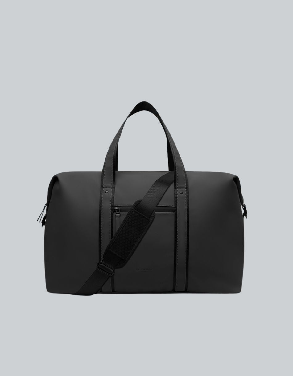 Bolso de viaje Däsh 2.0 M Negro, vista frontal con asas y correa acolchada