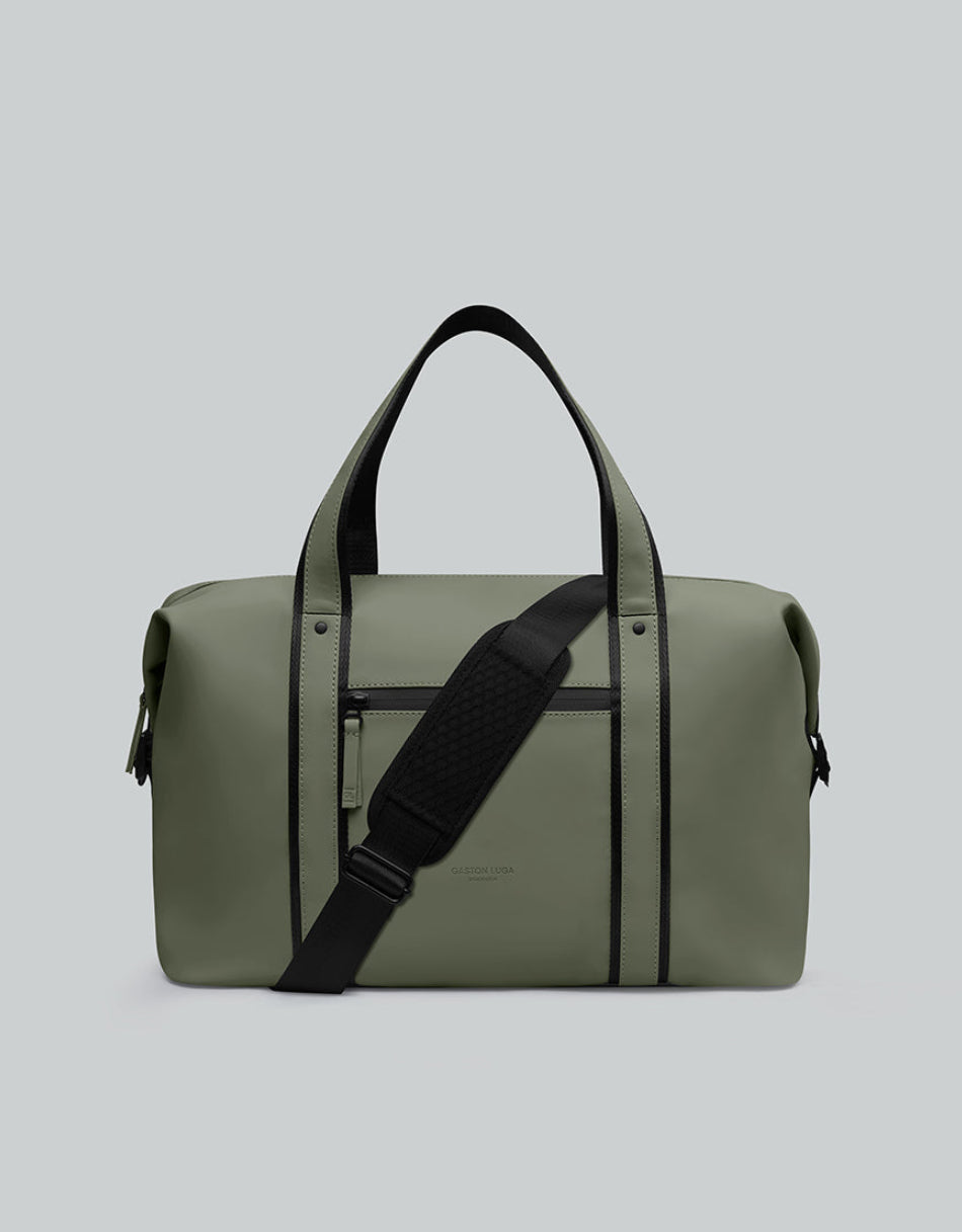 Bolso de viaje Däsh 2.0 CH Olivo, vista frontal con asas y correa