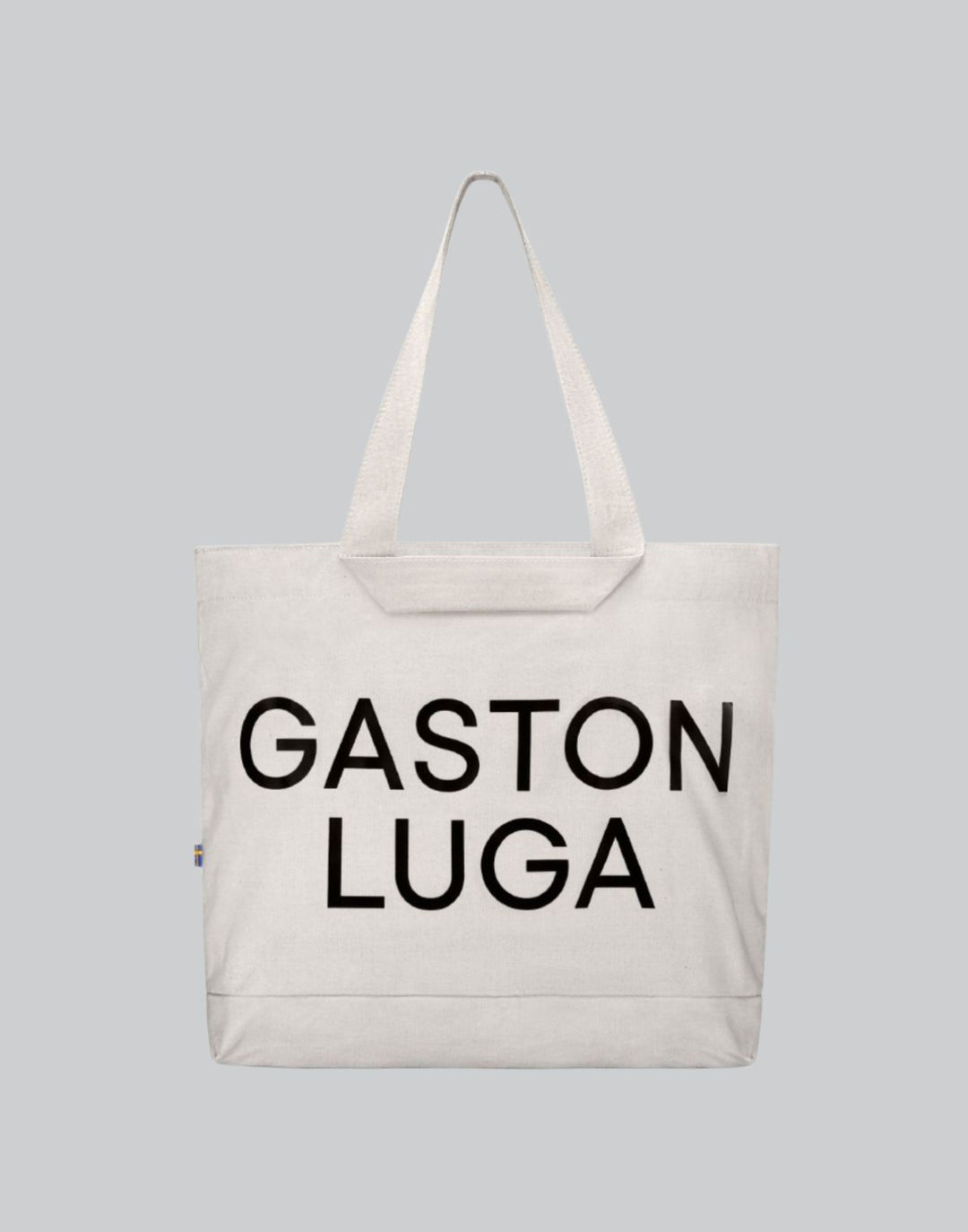 Bolso Canvas Tote Crema, vista frontal con letras Gaston Luga en negro